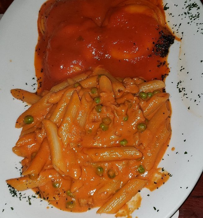 Osteria Natalina signature dishes  Lasagna Bolognese, Veal Scallopini, various handmade pastas (e.g., Tagliatelle al Ragu), Branzino, daily specials reflecting seasonal ingredients.